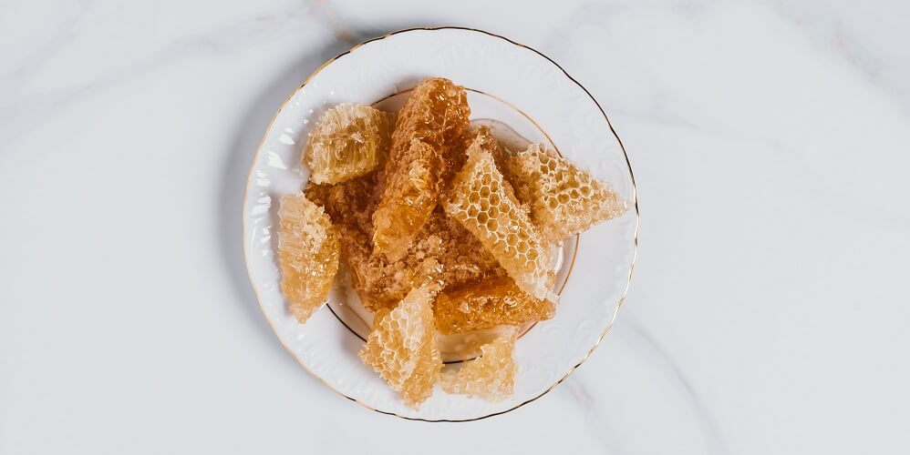 honeycombs ready to be eaten on a plate