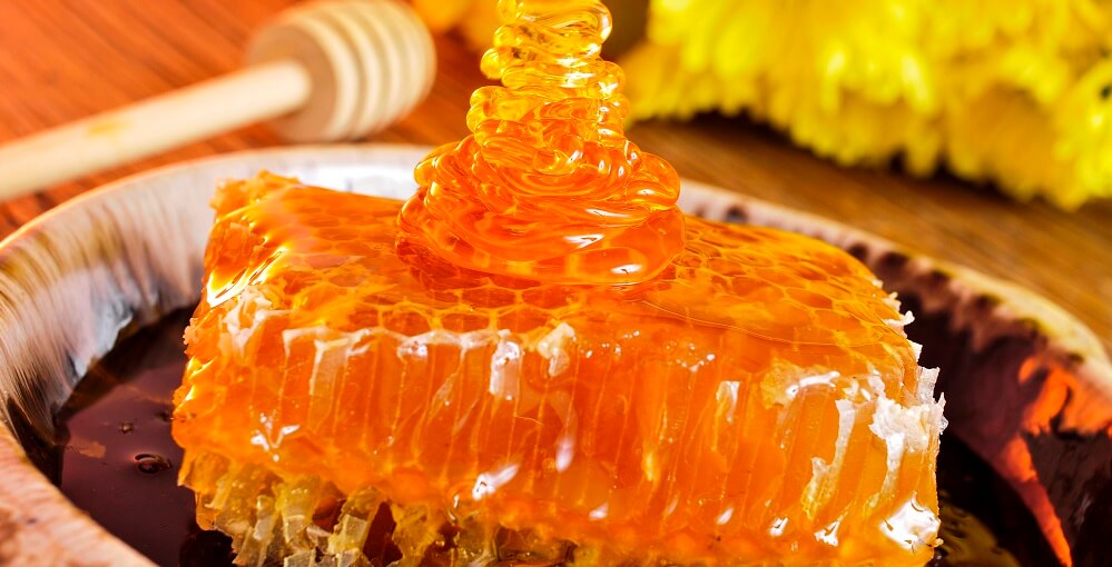 honey drizzled onto honeycomb